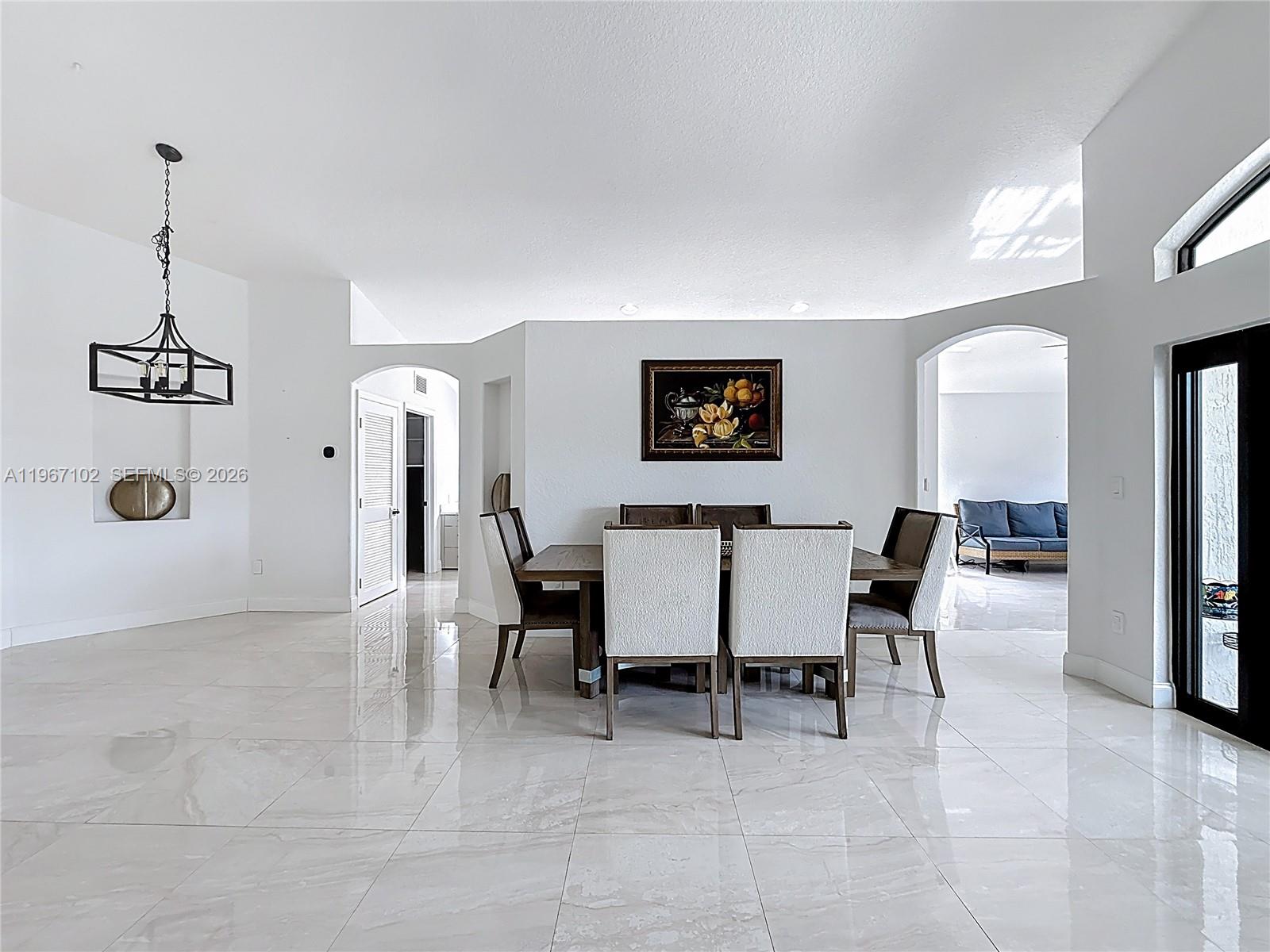 21102 Southwest 92nd Court Cutler Bay, FL 33189 - Photo 7 of 40 a view of a dining room with furniture