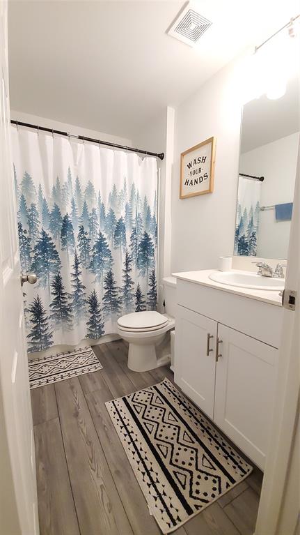 1653 Box Elder Road Forney, TX 75126 - Photo 12 of 21 a bathroom with a sink toilet a mirror and shower