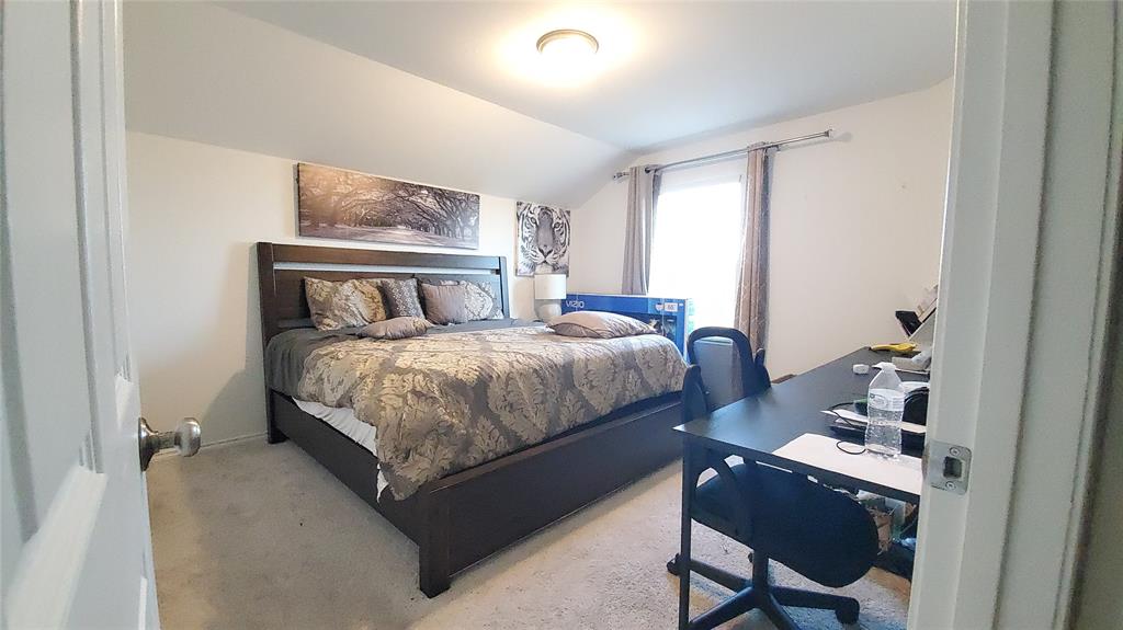 1653 Box Elder Road Forney, TX 75126 - Photo 13 of 21 a bedroom with a bed and dresser