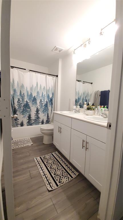1653 Box Elder Road Forney, TX 75126 - Photo 14 of 21 a bathroom with a sink a mirror and a toilet