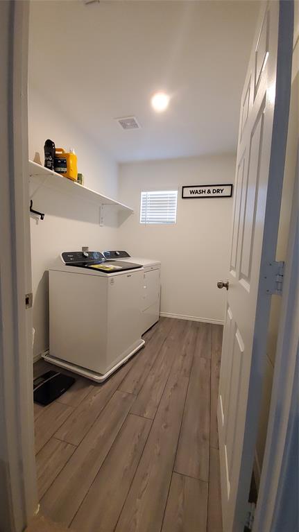 1653 Box Elder Road Forney, TX 75126 - Photo 15 of 21 a view of a storage and utility room with wooden floor