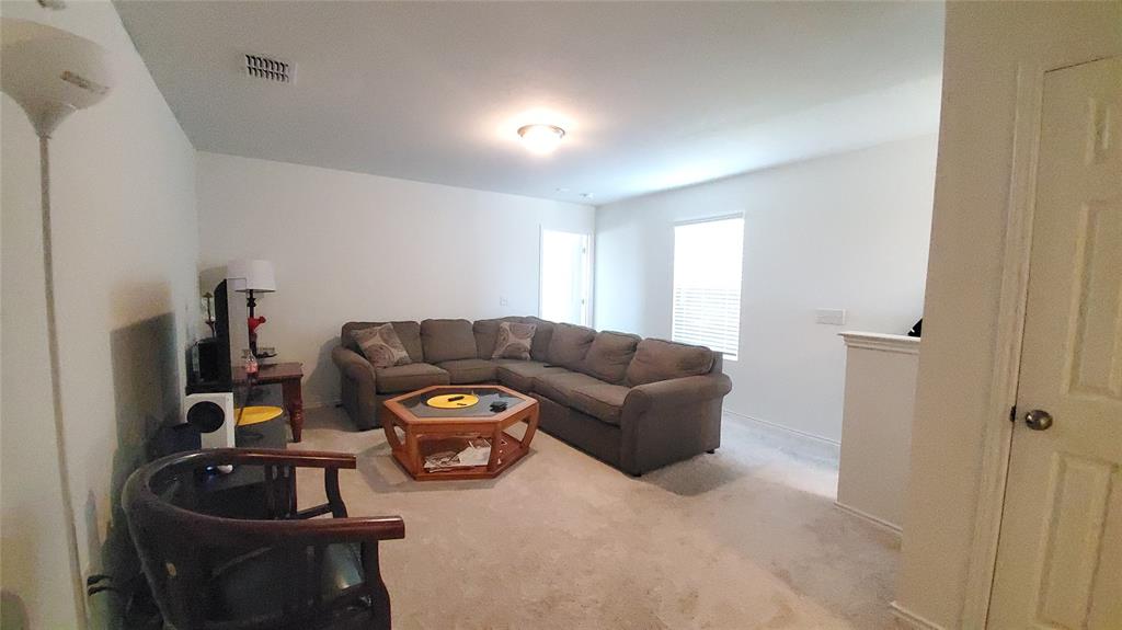1653 Box Elder Road Forney, TX 75126 - Photo 16 of 21 a living room with furniture and a window