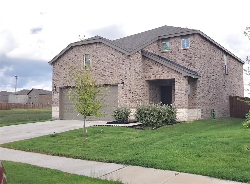 1653 Box Elder Road Forney, TX 75126 - Photo 2 of 21 a front view of a house with a garden and yard