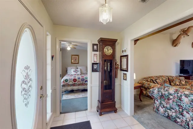 a bedroom with bed and a window