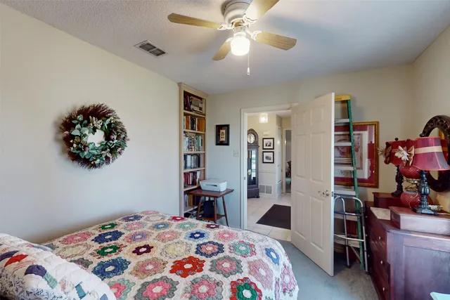 a bedroom with furniture and a clock