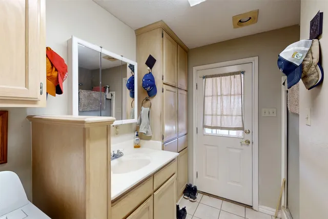 a bathroom with a sink double vanity and shower