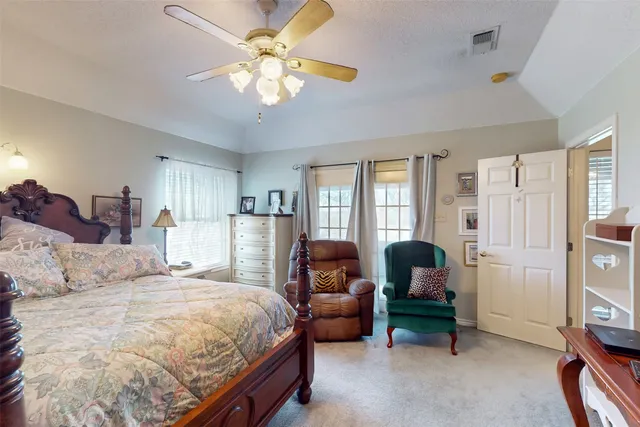 a spacious bathroom with a sink a large mirror and a shower