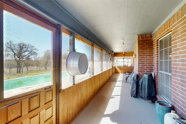 a swimming pool with outdoor seating and yard