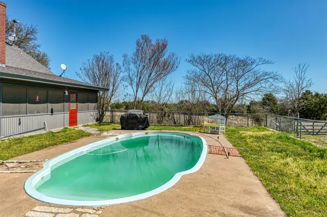 a view of a swimming pool with an ocean view
