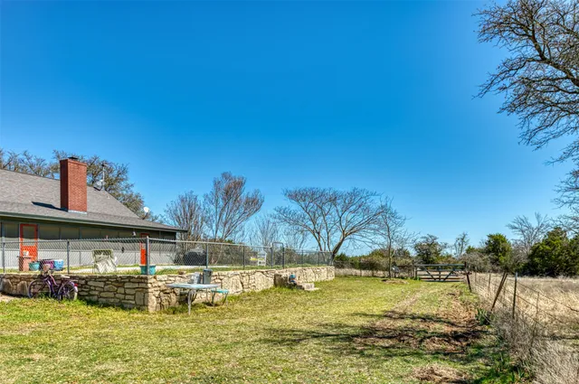 a view of swimming pool with outdoor seating and deck