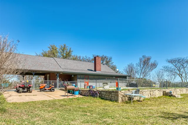a view of swimming pool with a garden and trees