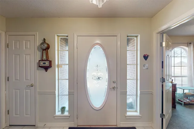 a bedroom with furniture and a large mirror