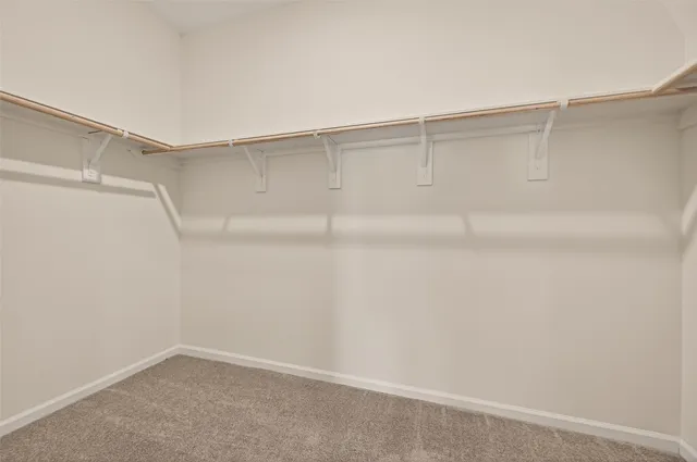 a view of a house with a backyard and a yard