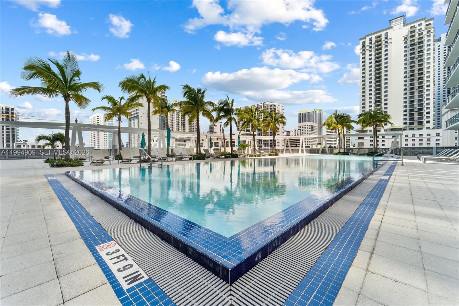 79 Southwest 12th Street, Unit 2108S Miami, FL 33130 - Photo 16 of 16 a view of swimming pool with outdoor seating and plants