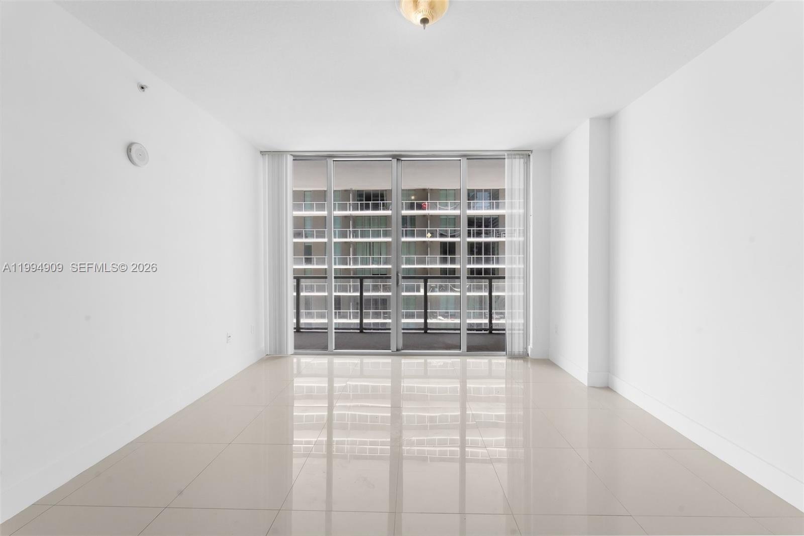 79 Southwest 12th Street, Unit 2108S Miami, FL 33130 - Photo 5 of 16 a view of an empty room with a white walls