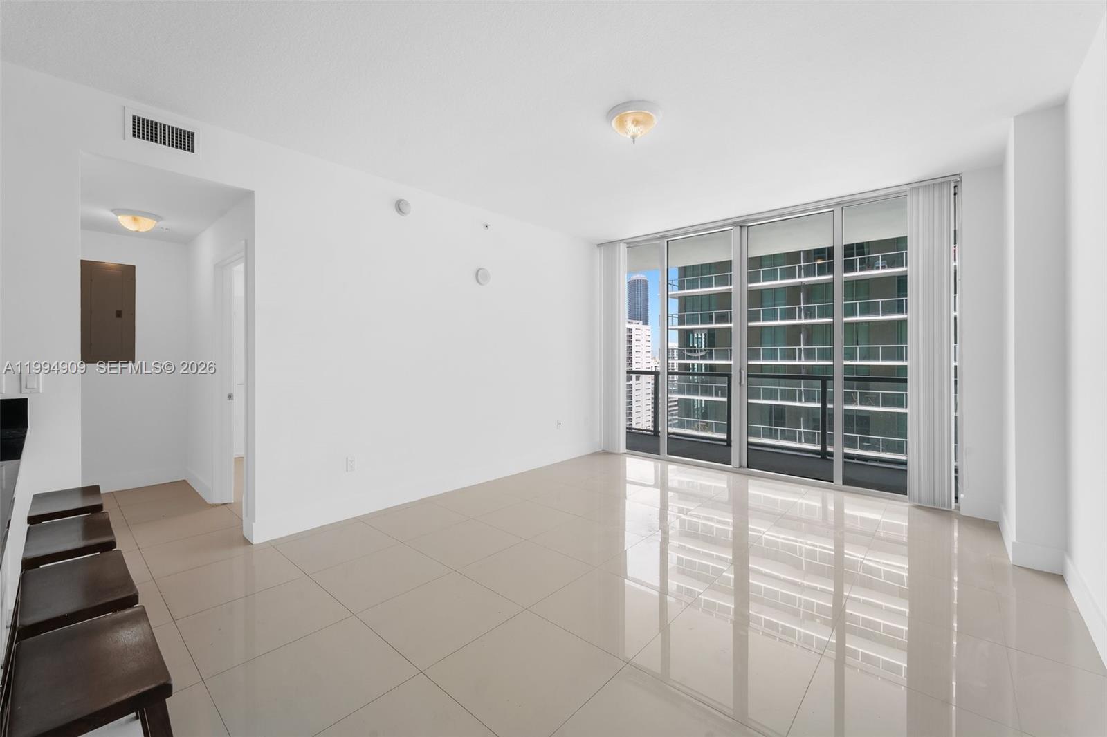 79 Southwest 12th Street, Unit 2108S Miami, FL 33130 - Photo 6 of 16 an empty room with windows