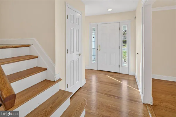 a view of entryway with wooden floor