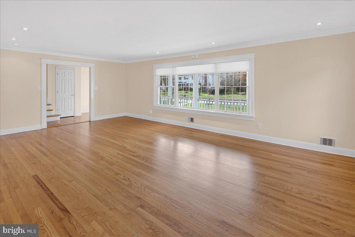 328 Dodds Lane Princeton, NJ 08540 - Photo 15 of 47 a view of empty room with wooden floor and fan