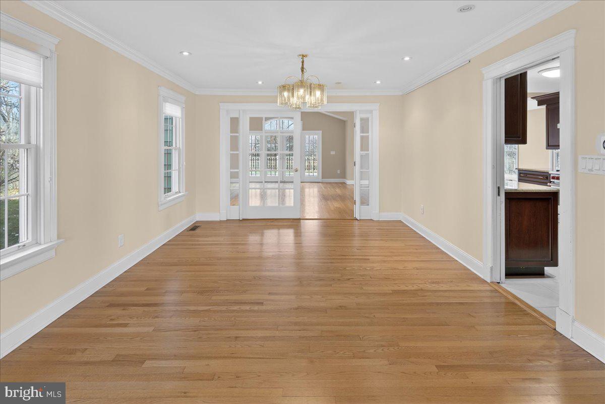 328 Dodds Lane Princeton, NJ 08540 - Photo 16 of 47 a view of an empty room with wooden floor and a window