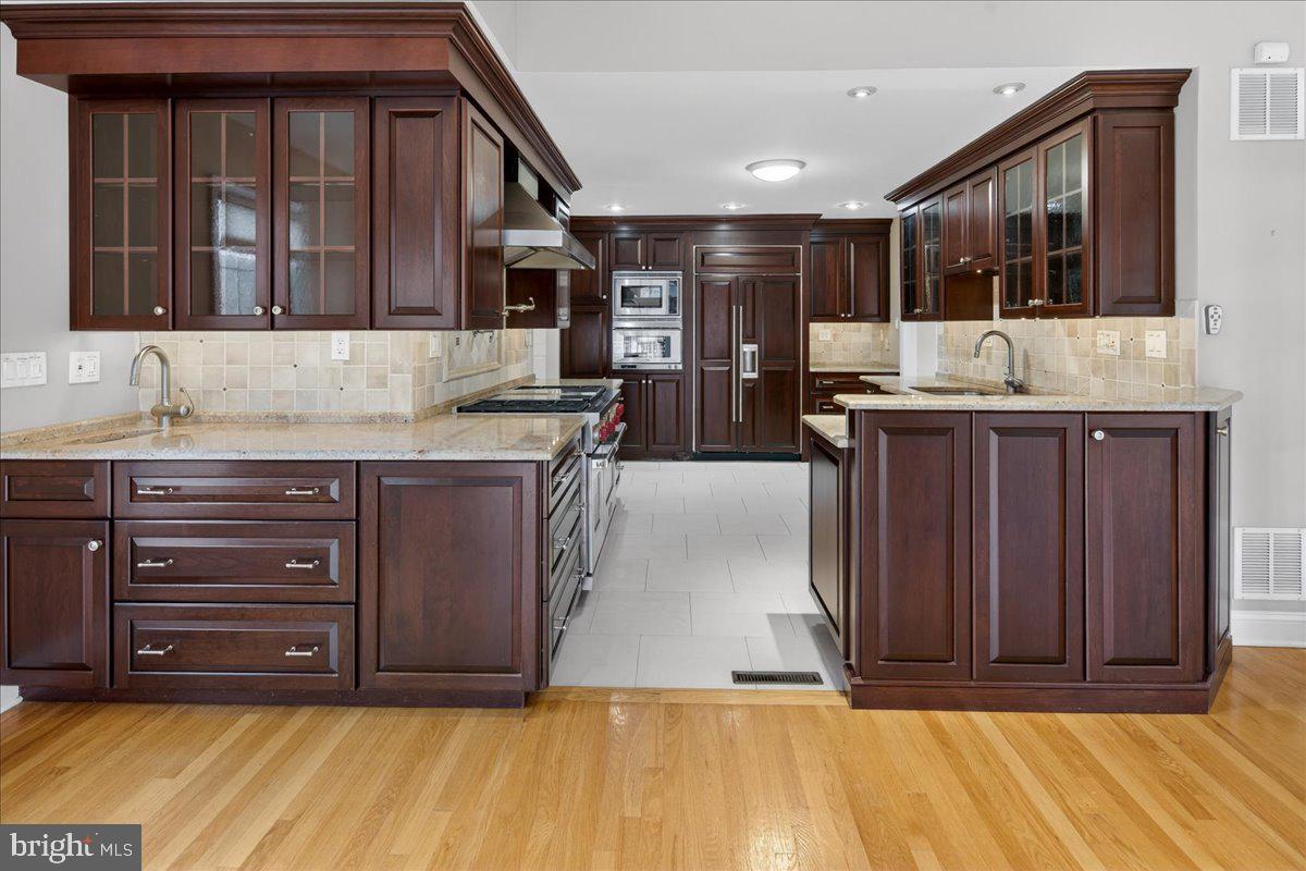 328 Dodds Lane Princeton, NJ 08540 - Photo 23 of 47 a kitchen with a sink and a wooden cabinets