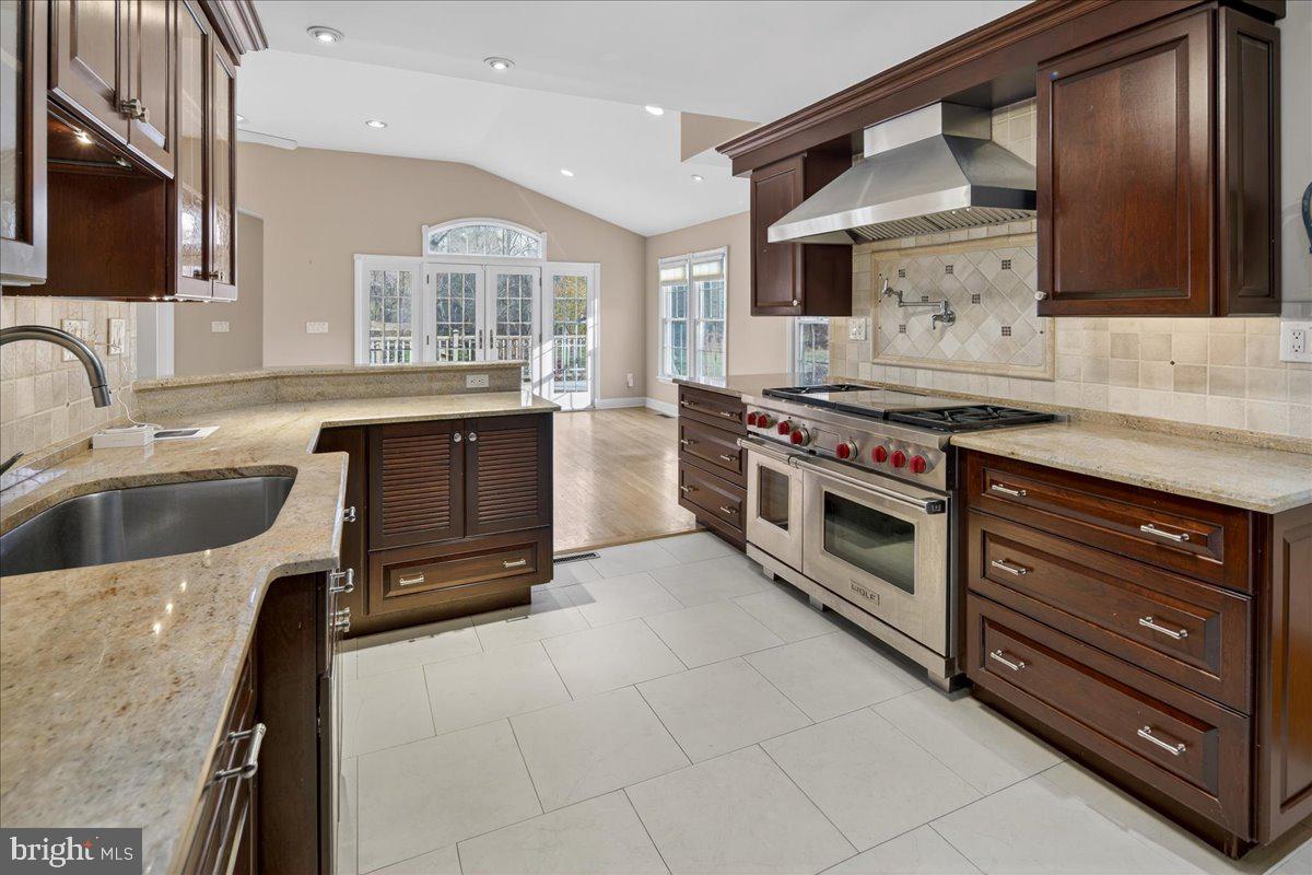 328 Dodds Lane Princeton, NJ 08540 - Photo 25 of 47 a kitchen with stainless steel appliances granite countertop a stove and a sink