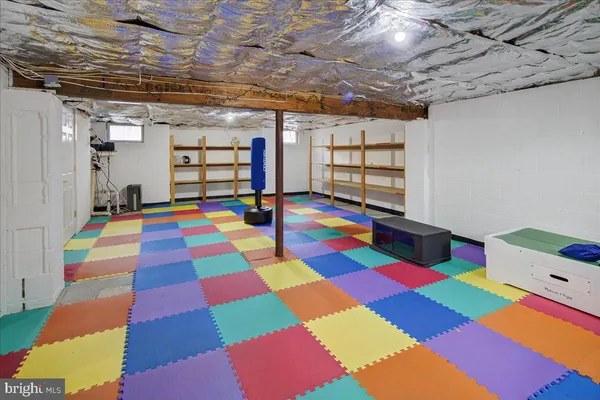 a room that has a bed and a table in it