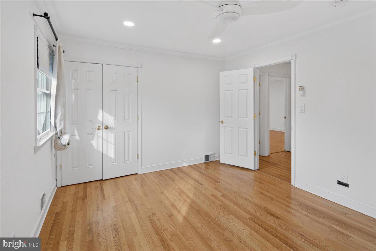 328 Dodds Lane Princeton, NJ 08540 - Photo 44 of 47 a view of empty room with wooden floor and white walls