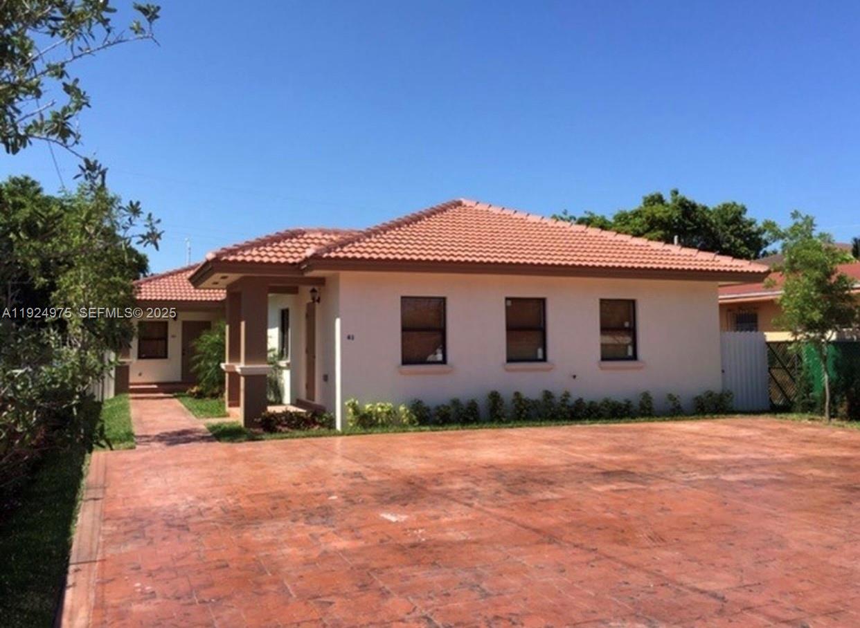 41 West 14th Street, Unit 1 Hialeah, FL 33010 - Photo 1 of 15 a view of a house with backyard and trees