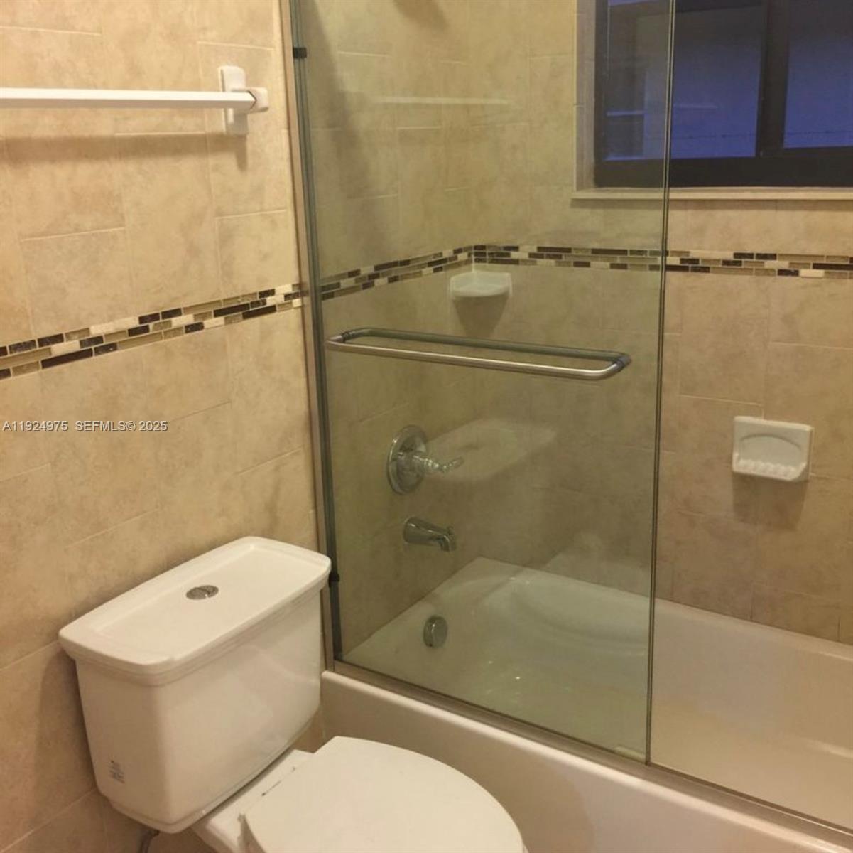 41 West 14th Street, Unit 1 Hialeah, FL 33010 - Photo 8 of 15 a bathroom with a toilet and a shower
