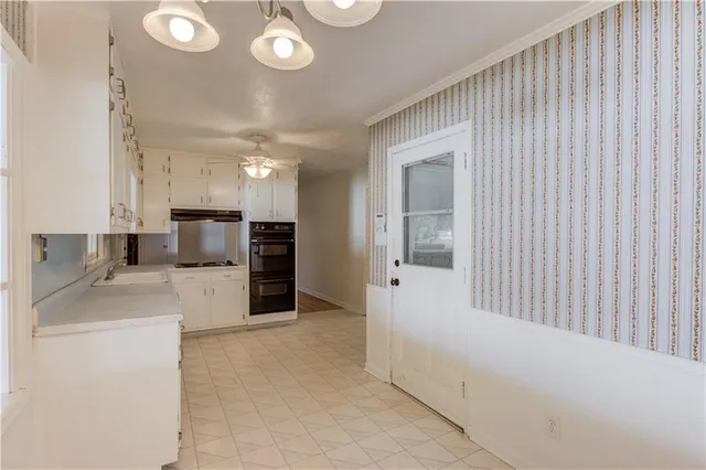 a view of a kitchen with a sink and dishwasher