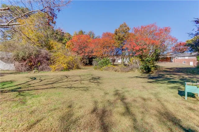 a view of outdoor space with trees all around
