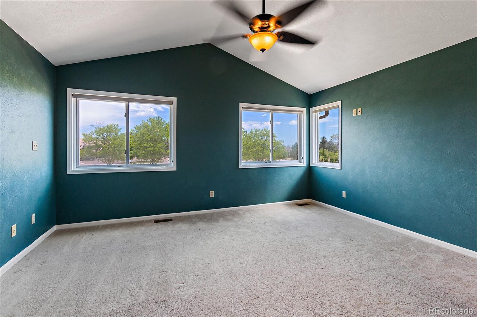 7503 Rattlesnake Drive Lone Tree, CO 80124 - Photo 19 of 29 a bedroom with window and ceiling fan