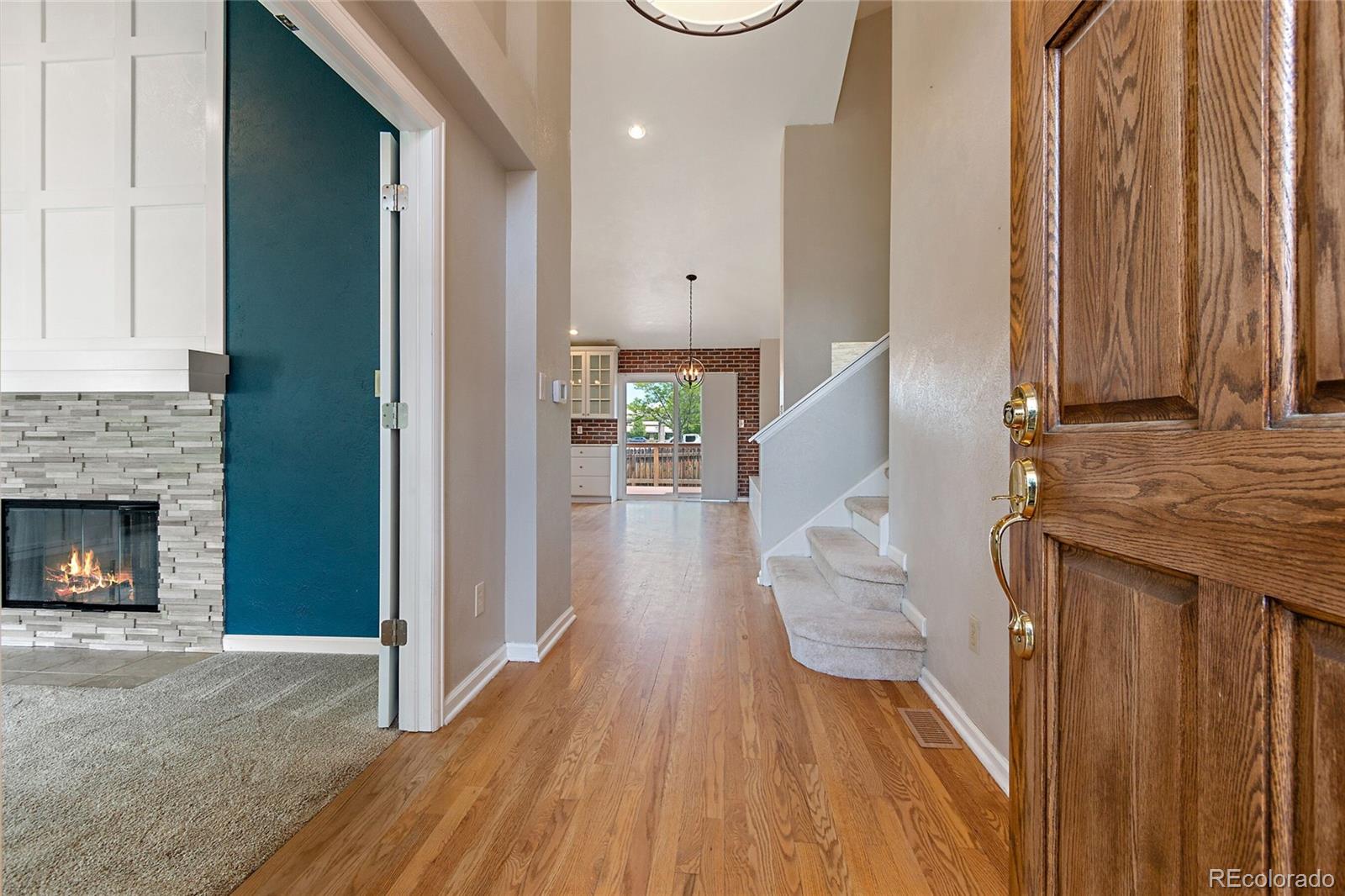 7503 Rattlesnake Drive Lone Tree, CO 80124 - Photo 2 of 29 a view of entryway and hall with wooden floor