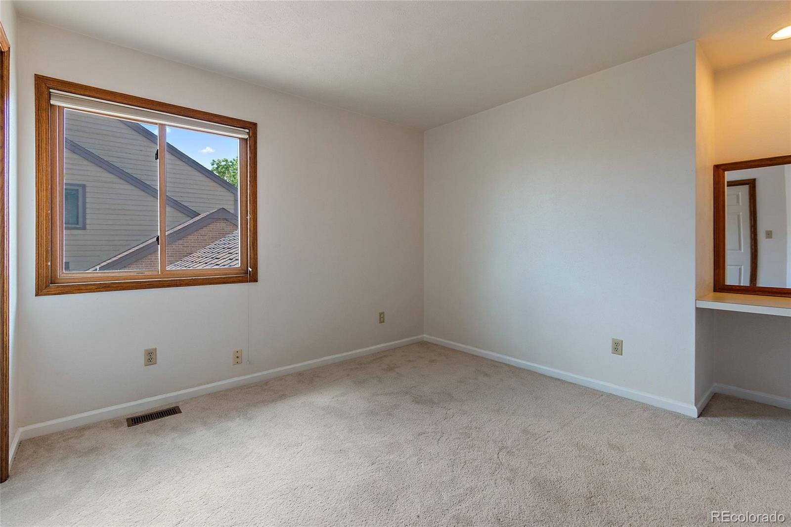 7503 Rattlesnake Drive Lone Tree, CO 80124 - Photo 23 of 29 a view of an empty room with closet and a window