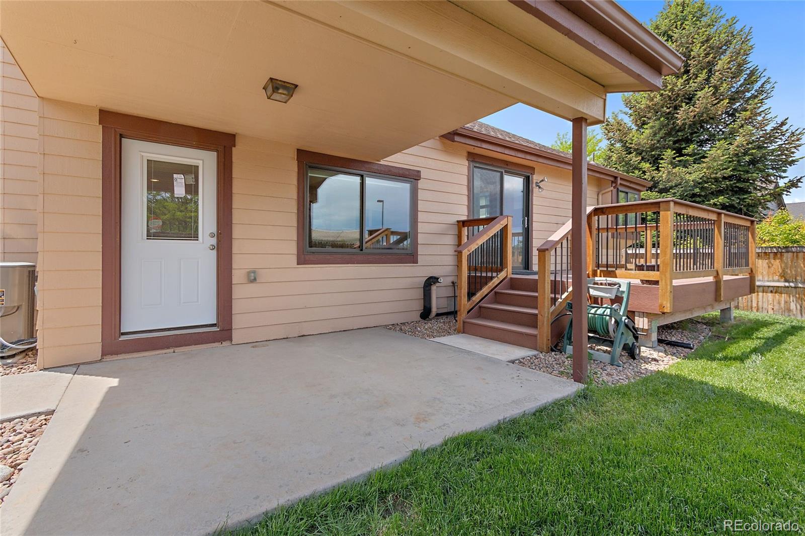 7503 Rattlesnake Drive Lone Tree, CO 80124 - Photo 27 of 29 a view of backyard with deck and a garden
