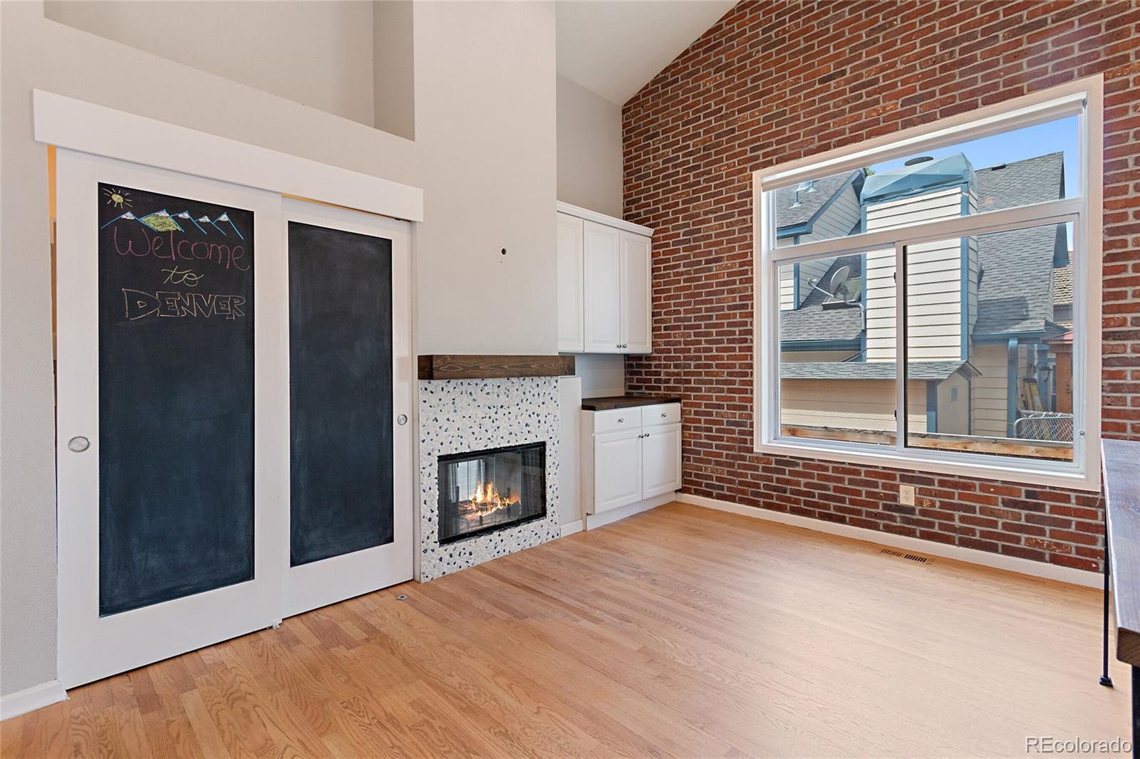 7503 Rattlesnake Drive Lone Tree, CO 80124 - Photo 4 of 29 a view of an empty room with a fireplace and a window