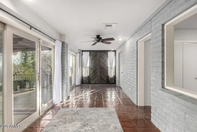 a large kitchen with stainless steel appliances kitchen island granite countertop a stove a sink dishwasher and a microwave oven with cabinets