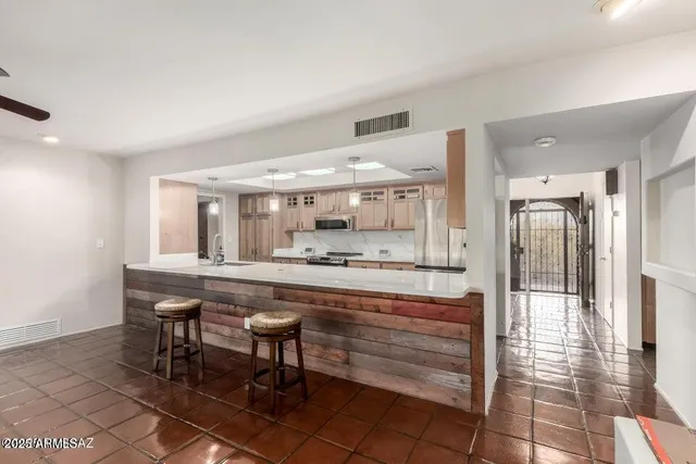 a bathroom with a granite countertop toilet sink and shower