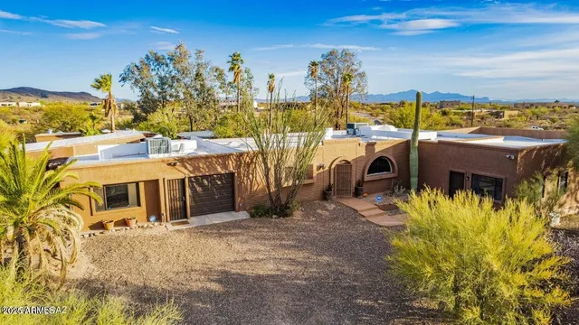 a view of a house with outdoor space and sitting area