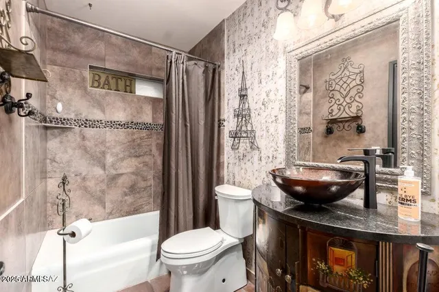 a kitchen with a sink a counter and cabinets