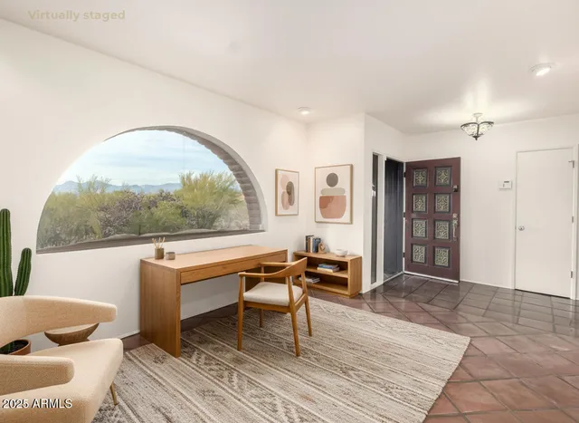 a dining room with furniture and window