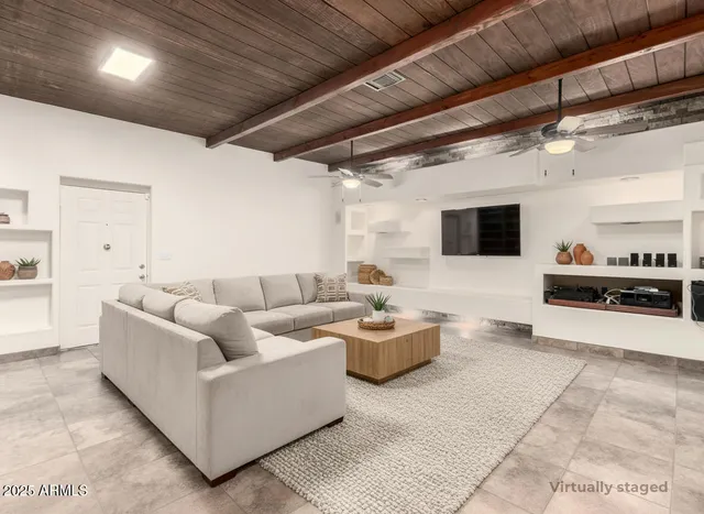 a kitchen with stainless steel appliances granite countertop a refrigerator a stove a microwave oven a sink with island and chairs