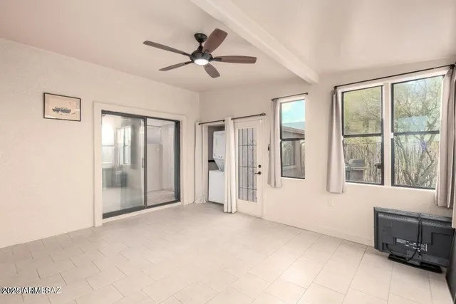 a view of an empty room with a window