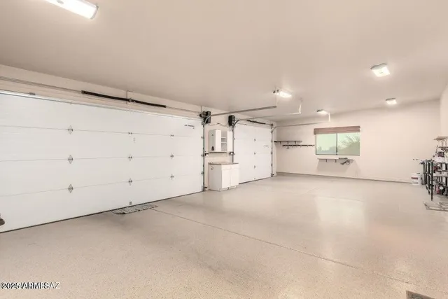 a view of a patio with couches chairs and a table and chairs with wooden floor
