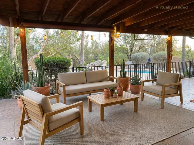 a view of a backyard with sitting area and furniture