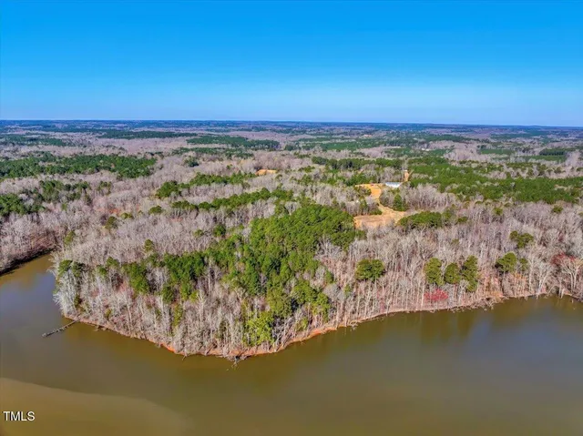 a view of a lake with a building in back