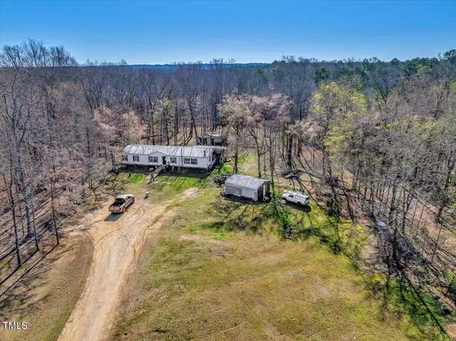 a view of a road with a building in the background