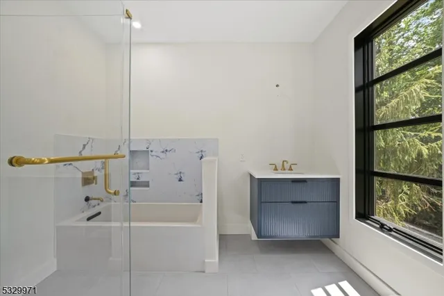 a utility room with sink dryer and washer