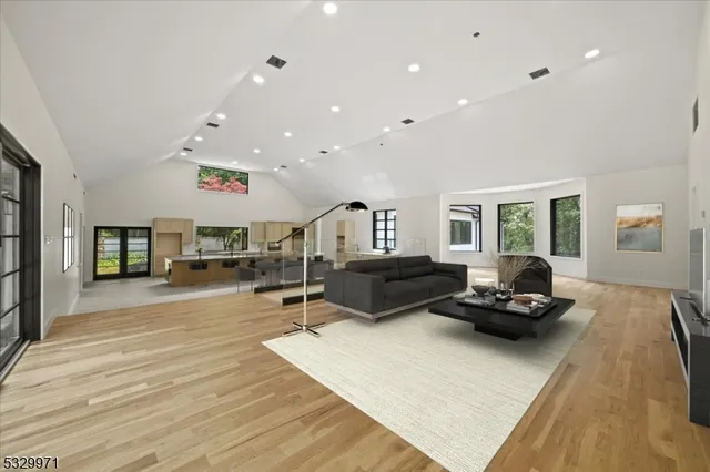a view of kitchen and hall with wooden floor