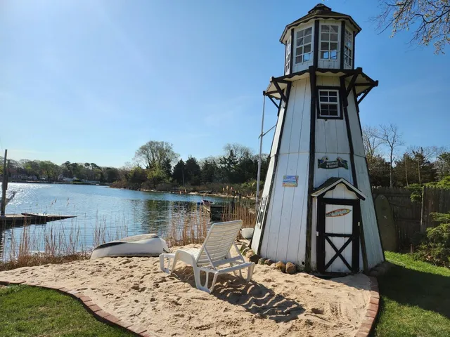 a view of a wooden deck with a lake view